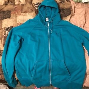 Nike zip up jacket with hoodie.